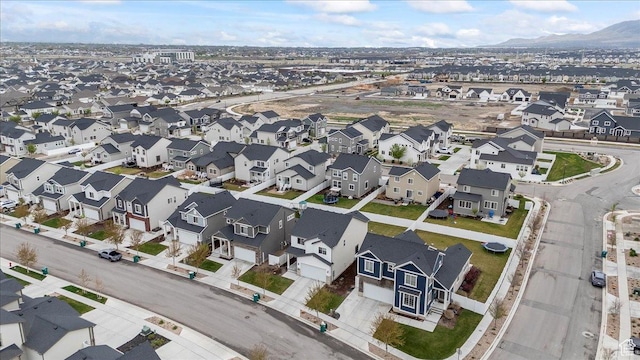 drone / aerial view with a mountain view and a residential view