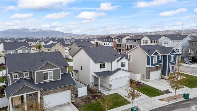 aerial view featuring a mountain view and a residential view