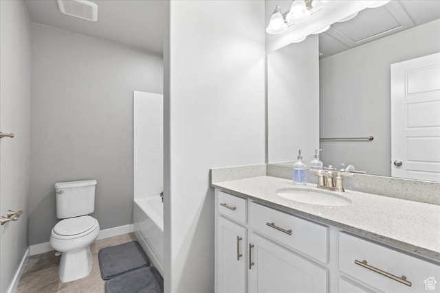 bathroom with baseboards, tile patterned flooring, vanity, and toilet