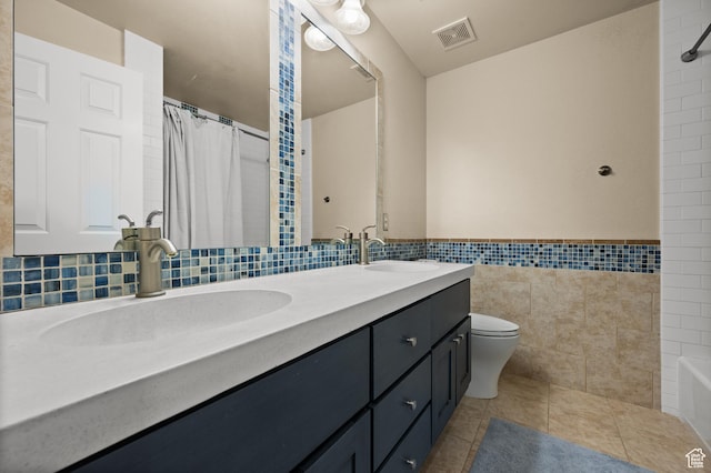1975 Picabo St, Park City, UT 84098 - full bath with double vanity, tile walls, visible vents, and a sink