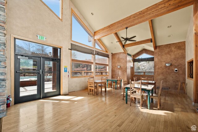 1975 Picabo St, Park City, UT 84098 - dining area featuring a wealth of natural light, beamed ceiling, a ceiling fan, hardwood / wood-style floors, and high vaulted ceiling