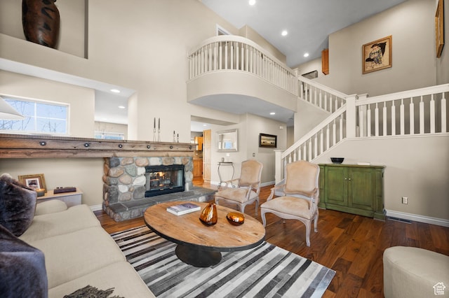 1975 Picabo St, Park City, UT 84098 - living room with stairway, wood finished floors, a high ceiling, and a stone fireplace