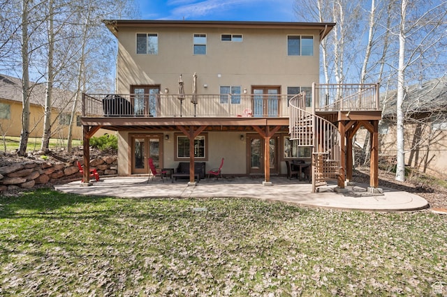 1975 Picabo St, Park City, UT 84098 - back of property featuring stucco siding, a wooden deck, stairway, and a patio area
