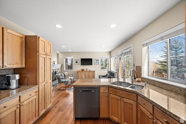 1975 Picabo St, Park City, UT 84098 - kitchen with a sink, light wood-type flooring, dishwasher, a fireplace, and a peninsula