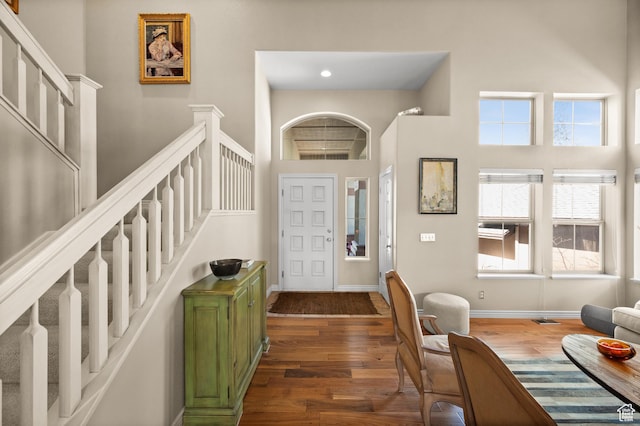 1975 Picabo St, Park City, UT 84098 - entrance foyer featuring stairway, a high ceiling, dark wood-style flooring, and baseboards