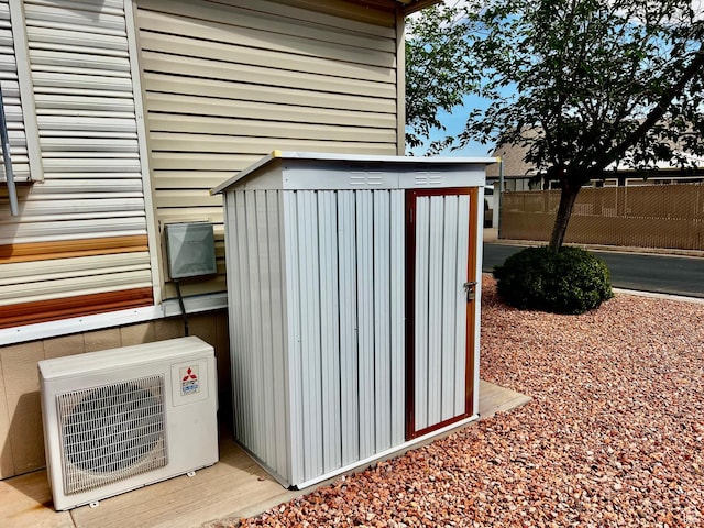 1150 W Red Hills Pkwy Unit 113, Washington, UT 84780 - view of shed featuring fence and ac unit