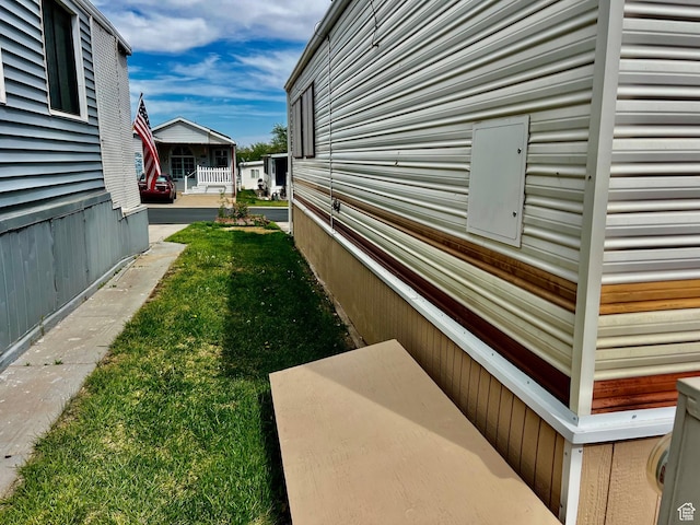 1150 W Red Hills Pkwy Unit 113, Washington, UT 84780 - view of side of property featuring a lawn