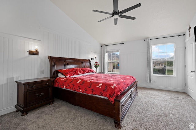 carpeted bedroom featuring high vaulted ceiling and ceiling fan