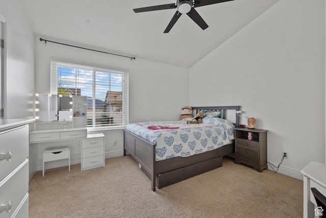 bedroom featuring baseboards, lofted ceiling, a ceiling fan, and light colored carpet