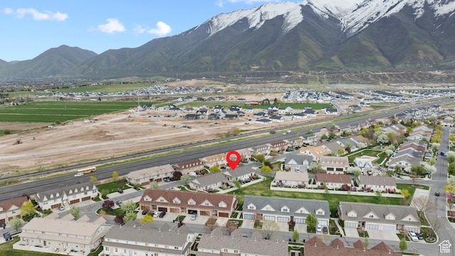 birds eye view of property with a mountain view and a residential view
