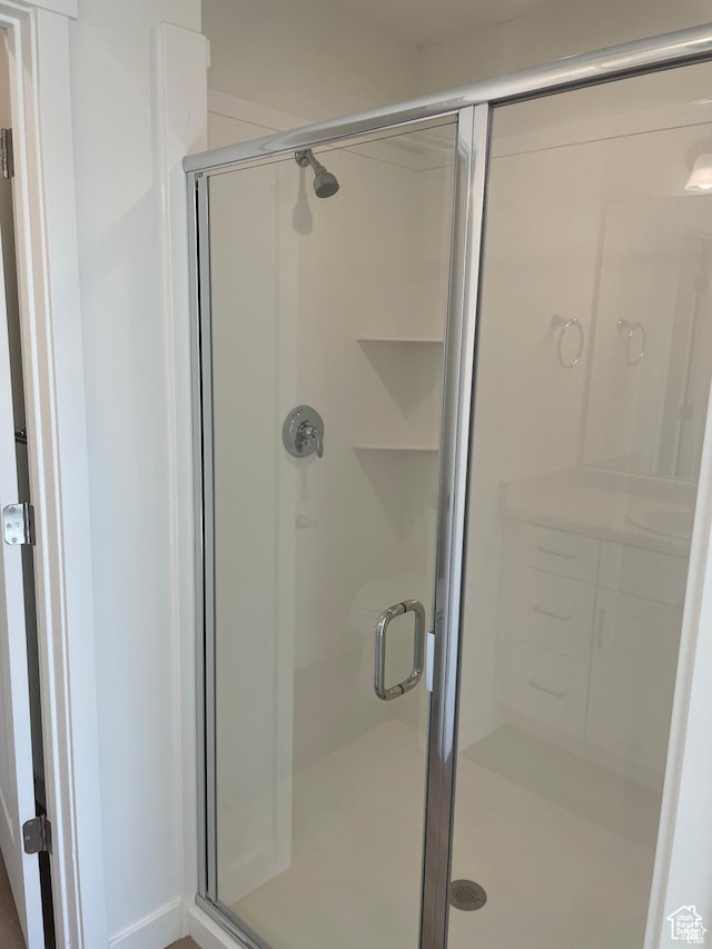 bathroom featuring a stall shower