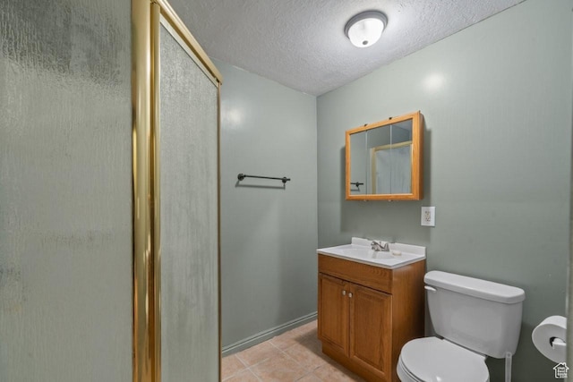 full bathroom with tile patterned flooring, an enclosed shower, toilet, vanity, and a textured ceiling