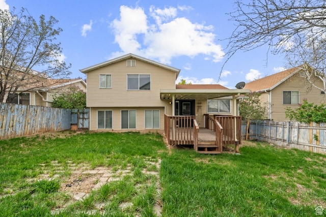 back of property featuring a fenced backyard, a yard, and a deck