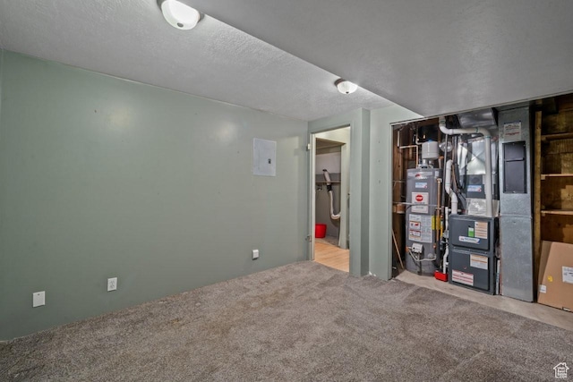 basement featuring carpet floors, gas water heater, and heating unit