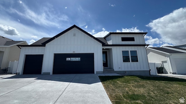 491 W 1860 N Unit 342, Tooele, UT 84074 - modern farmhouse with board and batten siding, an attached garage, concrete driveway, and a front lawn