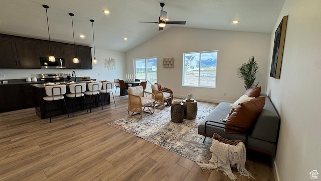491 W 1860 N Unit 342, Tooele, UT 84074 - living area featuring lofted ceiling, light wood-style floors, baseboards, recessed lighting, and a ceiling fan
