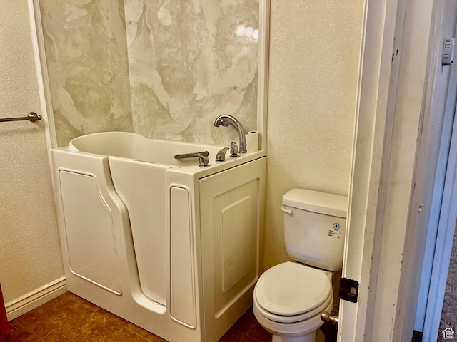1050 W Red Hills Pkwy Unit 64, Washington, UT 84780 - full bathroom with toilet, a textured wall, and tile patterned flooring