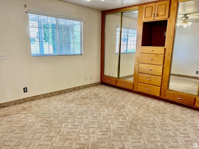 1050 W Red Hills Pkwy Unit 64, Washington, UT 84780 - unfurnished bedroom with baseboards and light colored carpet