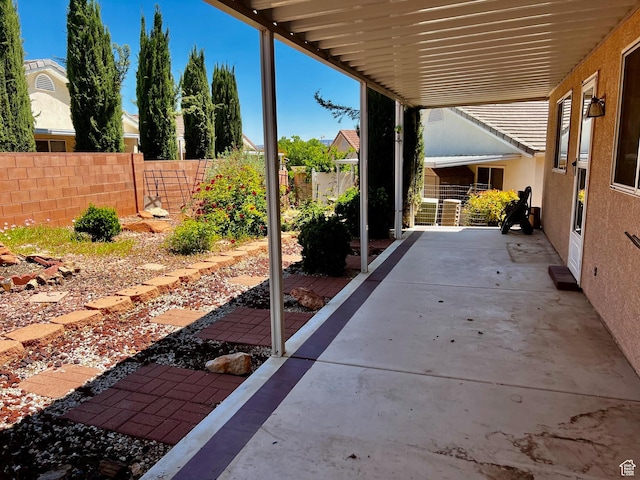1050 W Red Hills Pkwy Unit 64, Washington, UT 84780 - view of patio / terrace featuring fence