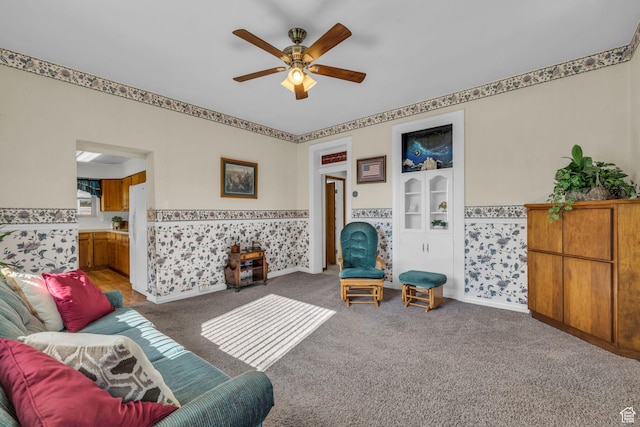 311 E 100 S, Springville, UT 84663 - carpeted living room featuring a ceiling fan, a wainscoted wall, and wallpapered walls