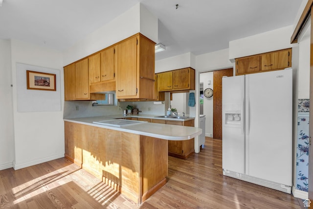 311 E 100 S, Springville, UT 84663 - kitchen featuring a sink, light wood-style floors, white fridge with ice dispenser, light countertops, and a peninsula