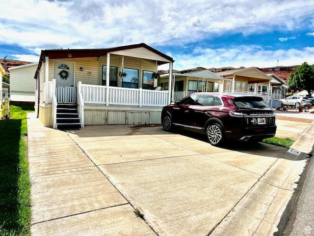 1150 W Red Hills Pkwy Unit 137, Washington, UT 84780 - view of front of home featuring a porch