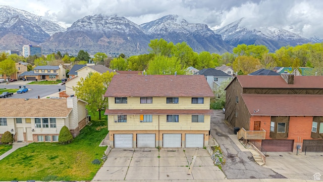 drone / aerial view with a mountain view and a residential view
