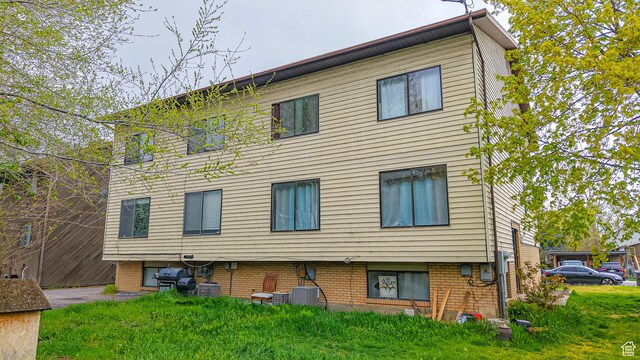 rear view of house with central AC