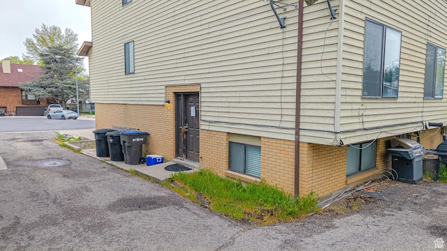 view of side of home featuring brick siding