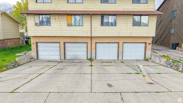 garage with concrete driveway