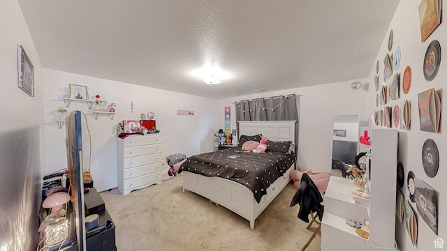 carpeted bedroom with a textured ceiling