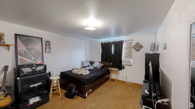 bedroom with a textured ceiling and carpet flooring
