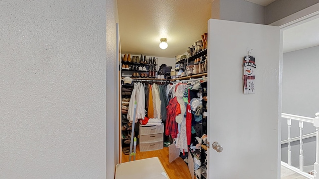 spacious closet with wood finished floors
