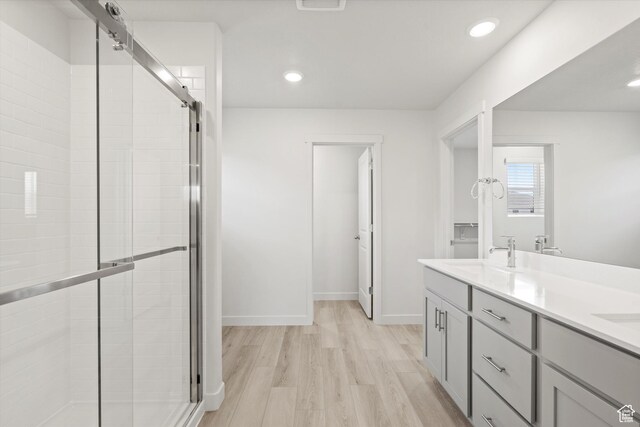 3448 S 3100 W Unit 153, West Haven, UT 84401 - bathroom with a stall shower, wood finished floors, double vanity, and recessed lighting