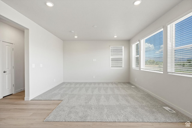 3448 S 3100 W Unit 153, West Haven, UT 84401 - spare room with recessed lighting, light colored carpet, and light wood-type flooring