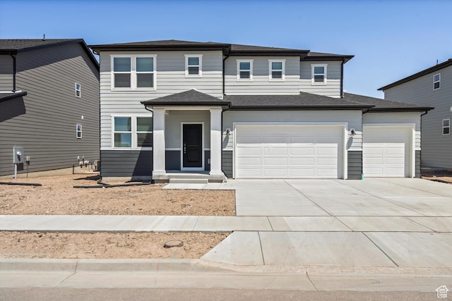 3448 S 3100 W Unit 153, West Haven, UT 84401 - view of front facade with concrete driveway and an attached garage
