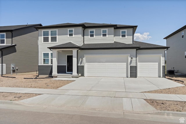 3448 S 3100 W Unit 153, West Haven, UT 84401 - view of front of home with driveway, an attached garage, and a garage
