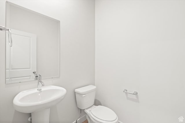3448 S 3100 W Unit 153, West Haven, UT 84401 - bathroom featuring baseboards and toilet