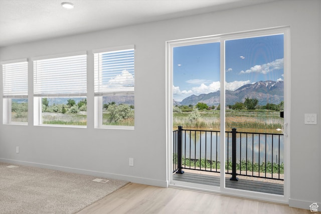3448 S 3100 W Unit 153, West Haven, UT 84401 - spare room featuring a water and mountain view and wood finished floors