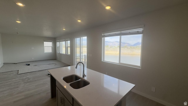 3448 S 3100 W Unit 153, West Haven, UT 84401 - kitchen with a center island with sink, a sink, open floor plan, recessed lighting, and light wood-style flooring