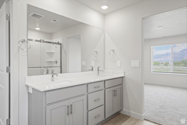 3448 S 3100 W Unit 153, West Haven, UT 84401 - full bath featuring double vanity, a stall shower, a textured ceiling, and recessed lighting