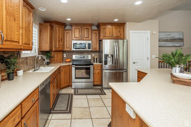5195 S 5825 W, Hooper, UT 84315 - kitchen featuring stainless steel appliances, a sink, and brown cabinets