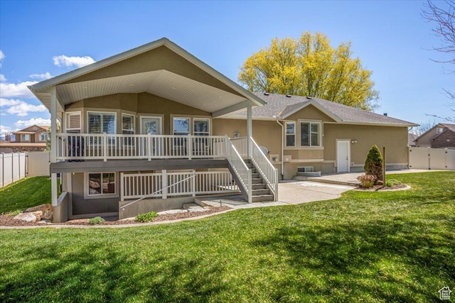 5195 S 5825 W, Hooper, UT 84315 - rear view of property featuring stairs, a fenced backyard, stucco siding, a lawn, and a deck