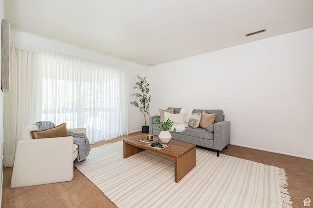 325 E 2550 N Unit 4, North Ogden, UT 84414 - living room featuring baseboards, visible vents, and carpet floors
