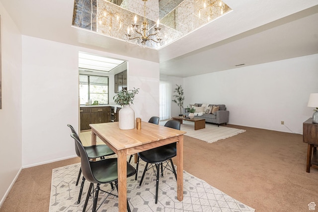 325 E 2550 N Unit 4, North Ogden, UT 84414 - dining area featuring light colored carpet and an inviting chandelier