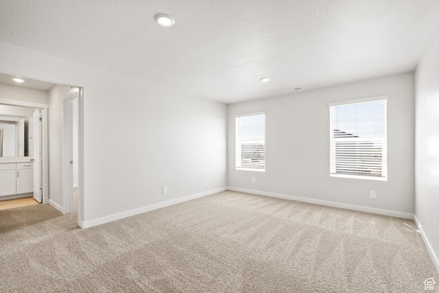 3444 S 3100 W Unit 154, West Haven, UT 84401 - empty room featuring light carpet, baseboards, recessed lighting, and a textured ceiling