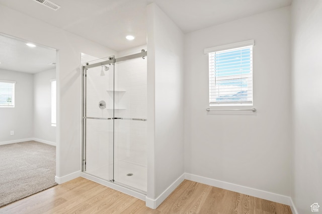 3444 S 3100 W Unit 154, West Haven, UT 84401 - full bathroom with a shower stall, baseboards, wood finished floors, and healthy amount of natural light
