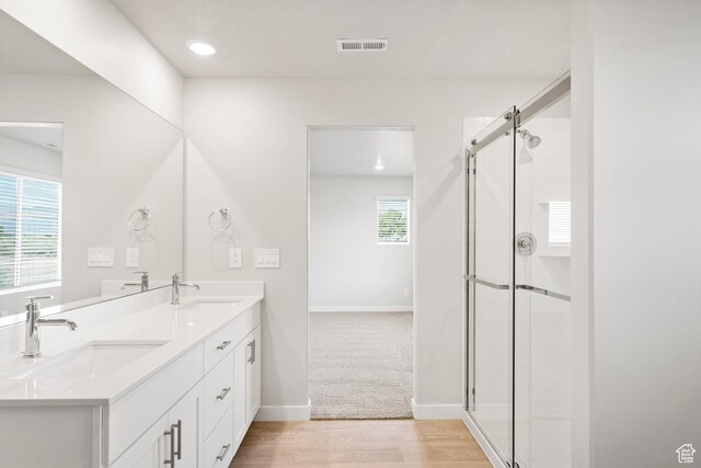 3444 S 3100 W Unit 154, West Haven, UT 84401 - full bath with double vanity, tiled shower, wood finished floors, baseboards, and recessed lighting