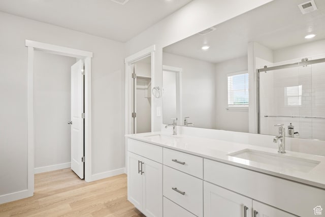 3444 S 3100 W Unit 154, West Haven, UT 84401 - full bath with double vanity, wood finished floors, a stall shower, baseboards, and recessed lighting