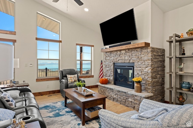 1428 N Broad Hollow Rd, Garden City, UT 84028 - living area with high vaulted ceiling, wood finished floors, ceiling fan, a fireplace, and baseboards